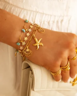 Finaste Armband met zeesterren turqouise goudkleurig Best
