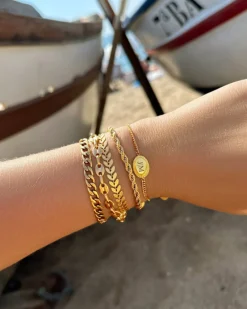 Finaste Schakelarmband gedraaid goudkleurig Best