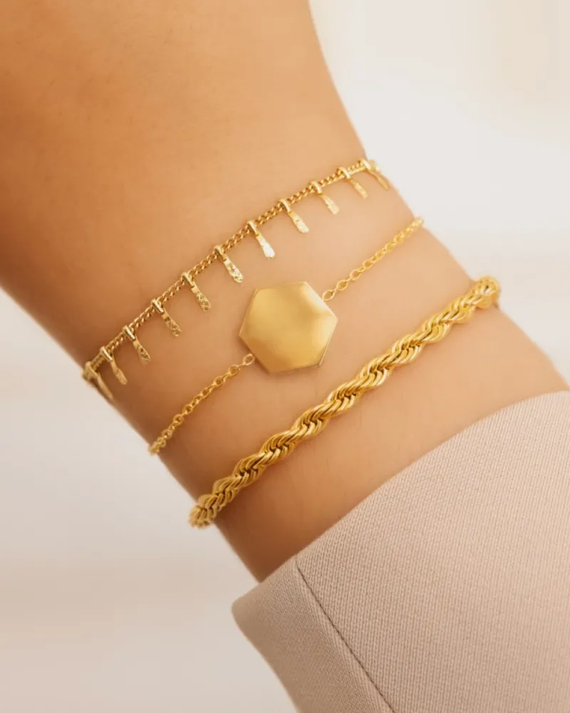 Finaste Schakelarmband gedraaid goudkleurig Best