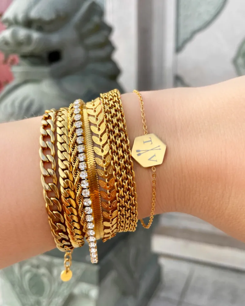 Finaste Schakelarmband gedraaid goudkleurig Best
