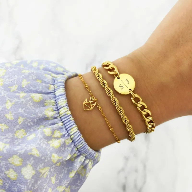 Finaste Schakelarmband gedraaid goudkleurig Best