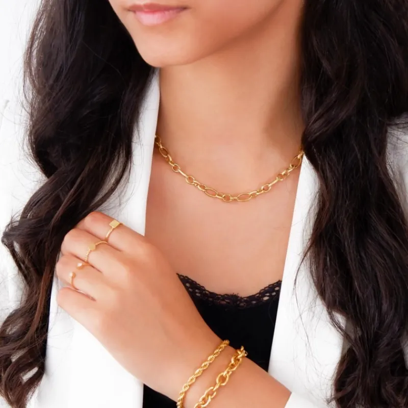 Finaste Schakelarmband gedraaid goudkleurig Best